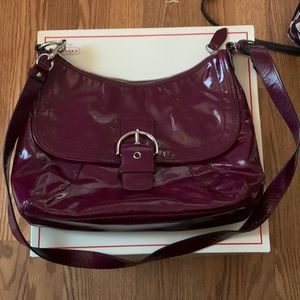 Coach purse, medium size. Over the shoulder.